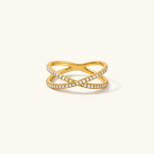 18K gold diamond cross ring pavé overhead flat lay product photography against neutral background