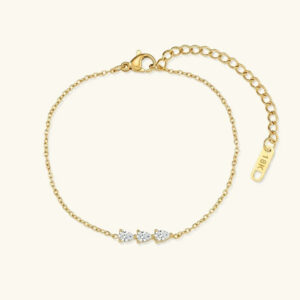 Alana teardrop diamond bracelet in 18K gold plating featuring three pear-shaped clear CZ stones on delicate gold cable chain with adjustable extension and 18K stamp tag