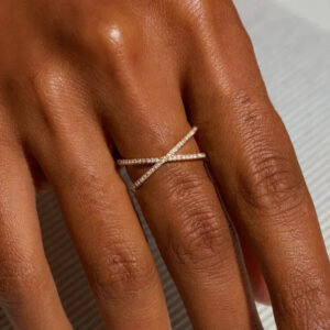 18K gold cross ring with diamond simulants worn on fingers close-up detail shot showing sparkle