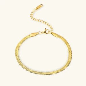 18K gold herringbone bracelet flat lay top-down view showing intricate weave pattern and adjustable extender chain