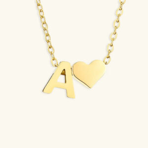 18K gold initial letter A heart charm necklace flat lay top view polished cable chain