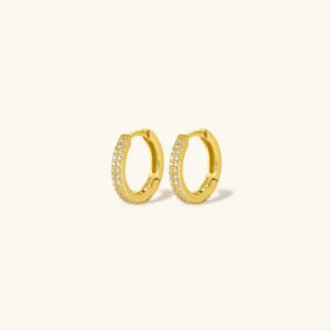18k gold pavé hoop earrings front view with cubic zirconia stones on plain background flat lay