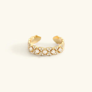 18K gold quatrefoil lattice open cuff ring with crystal accents flat lay front view