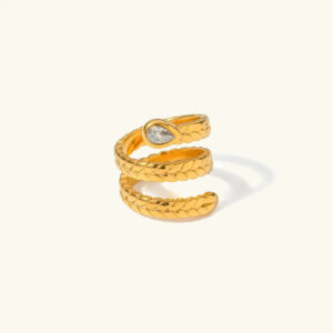 18K gold serpent wrap ring front view three-layer coil design with diamond simulant accent flat lay