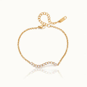 18K gold wavy cubic zirconia bracelet overhead flat lay view with adjustable extender chain on white background