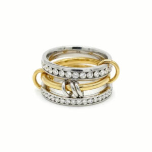 18K gold and silver two-tone stacked diamond ring flat lay view, showing intricate pavé cubic zirconia bands with mixed metal connectors on white background