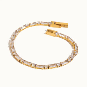 18K gold tennis bracelet with mixed baguette and round cubic zirconia stones, flat lay top-down view on white background, featuring secure box clasp
