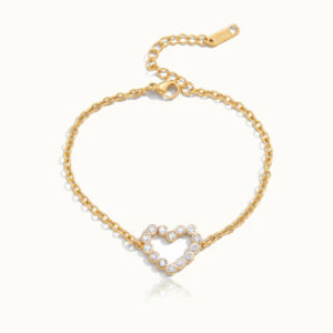 18K gold heart diamond bracelet flat lay overhead view showing twisted cable chain with sparkling crystal heart charm and adjustable extension clasp on white studio background