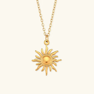 18K gold sun pendant necklace front view with radiating charm design on light background