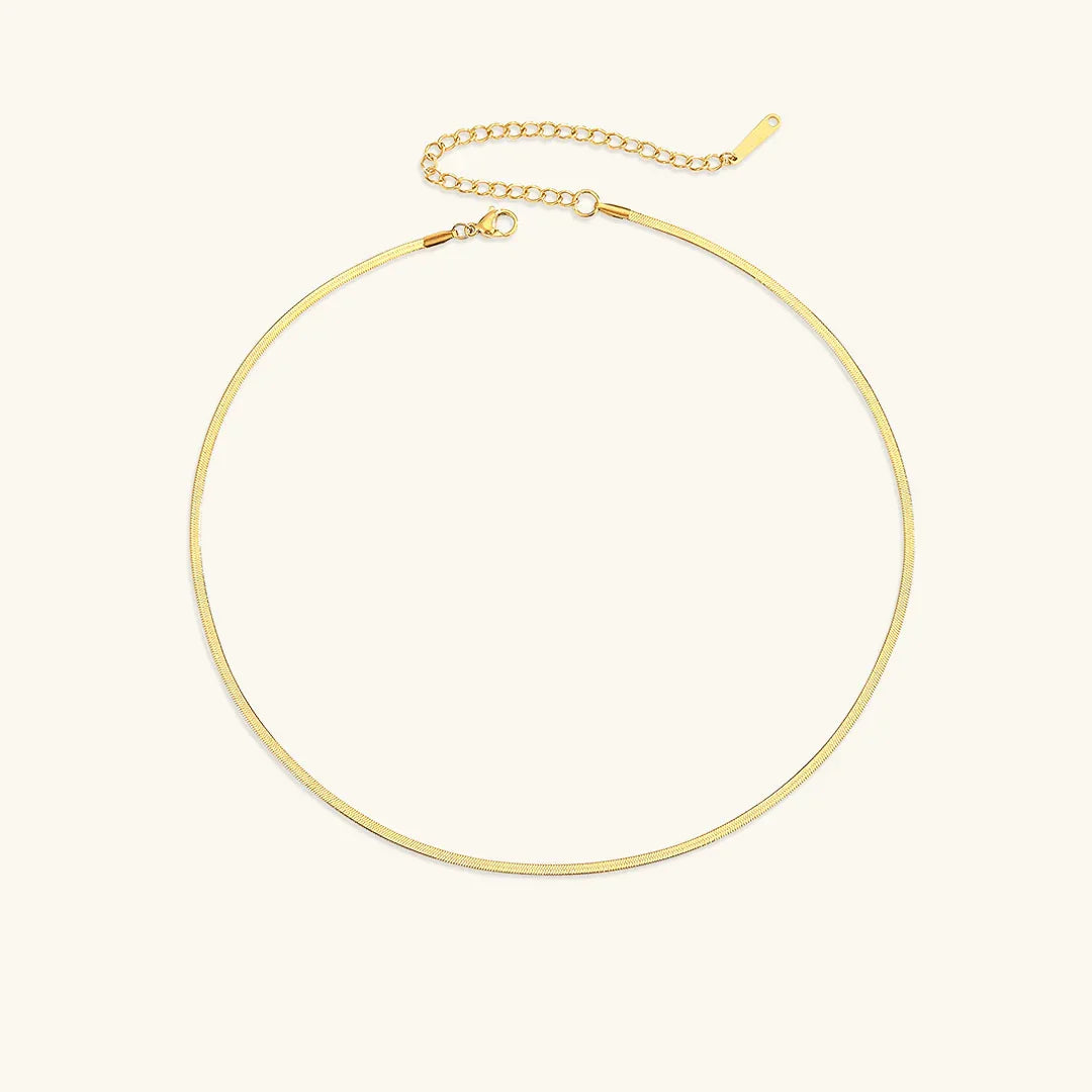 18K gold herringbone necklace 2mm width flat lay product shot showing intricate V-shaped chain link pattern