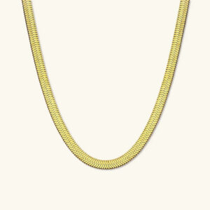 18K gold herringbone necklace flat lay display showing interlocking chain pattern and polished gold finish on light background