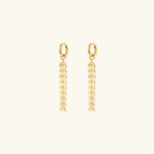 18K gold fishtail leaf drop earrings with tassel pendant flat lay on beige background - front view showing huggie hoop design
