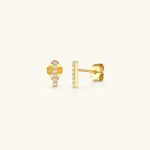 18K gold paved crystal stud earrings front view flat lay luxury jewelry piece with brilliant cubic zirconia gemstone