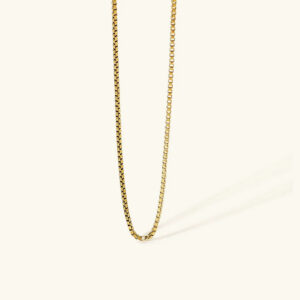 18K gold box chain necklace with square links flat lay on neutral background, showcasing polished gold finish and precise chain construction