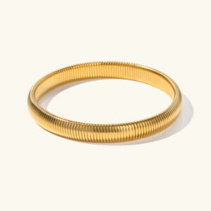 18k gold ribbed stretch bracelet size small flat lay top down view textured surface warm gold finish