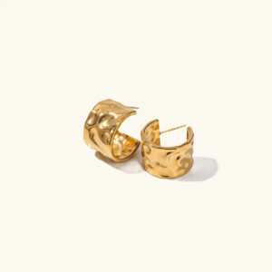 18K yellow gold hammered hoop earrings flat lay top view with textured surface
