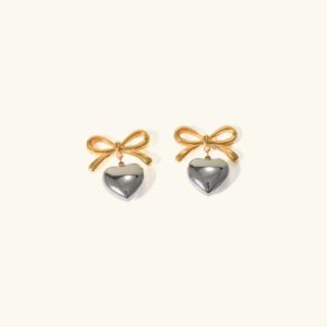 18K gold two-tone heart bow dangle earrings with french knot design front flat lay view on white background showing gold bow charm and silver heart pendant