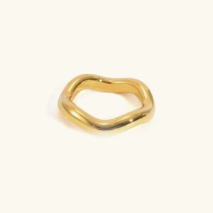 18K gold wave ring flat lay top view polished finish warm off-white background minimalist design