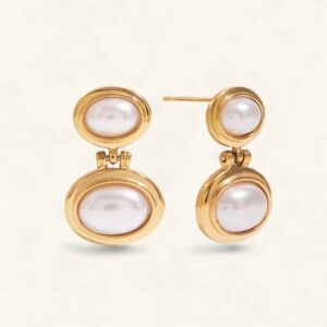 18K gold freshwater pearl drop earrings front view flat lay display on light background showing oval pearl design with polished gold bezels