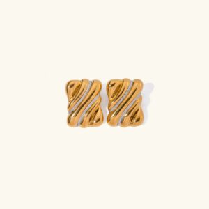 18k gold twisted wave stud earrings with silver stripe details flat lay product photography plain background