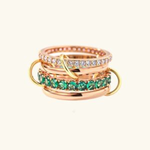 18K gold stacked diamond emerald ring front view flat lay with diamond simulants and emerald bands