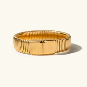 18K gold ribbed stretch bracelet front flat lay view polished vertical texture magnetic clasp white background