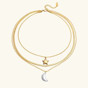18k gold star moon layered necklace flat lay product shot with three-chain design and pearl crescent pendant on clean light background