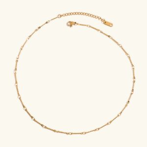 18K gold linked chain necklace with twisted link design, flat lay overhead view on neutral background showing full length and secure lobster clasp