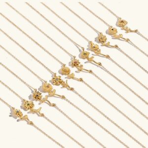 Collection of 18K gold birth flower necklaces with assorted delicate floral pendants on thin gold chains