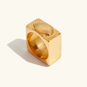 18K gold geometric shell statement ring front view flat lay with plain background, square band design with sculpted seashell relief center