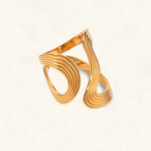 18K gold twisted open band ring side profile close-up flat lay on off-white background striped textured design