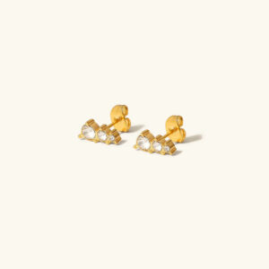 18k gold cluster stud earrings with cubic zirconia stones flat lay top view on white background