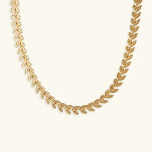 18K gold wheat leaf chain necklace flat lay overhead view textured botanical design matte gold finish