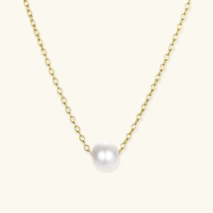 18K gold freshwater pearl necklace flat lay - twisted cable chain with round white pearl pendant on light beige background