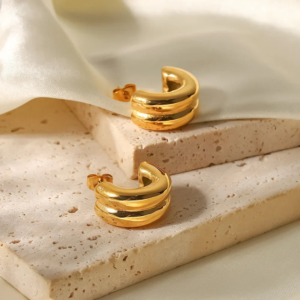 18K gold chunky double-band hoop earrings certification and authenticity marking detail shot