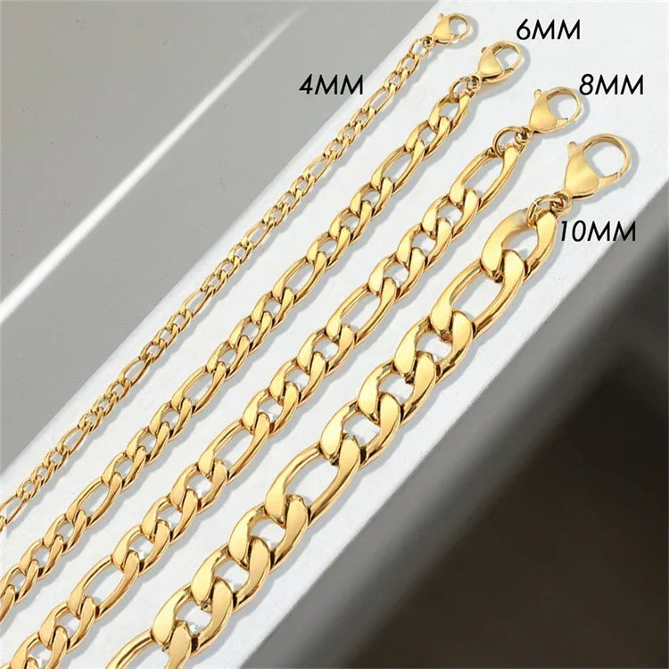 Four size options figaro gold chain necklaces 4mm 6mm 8mm 10mm flat lay comparison on grey background