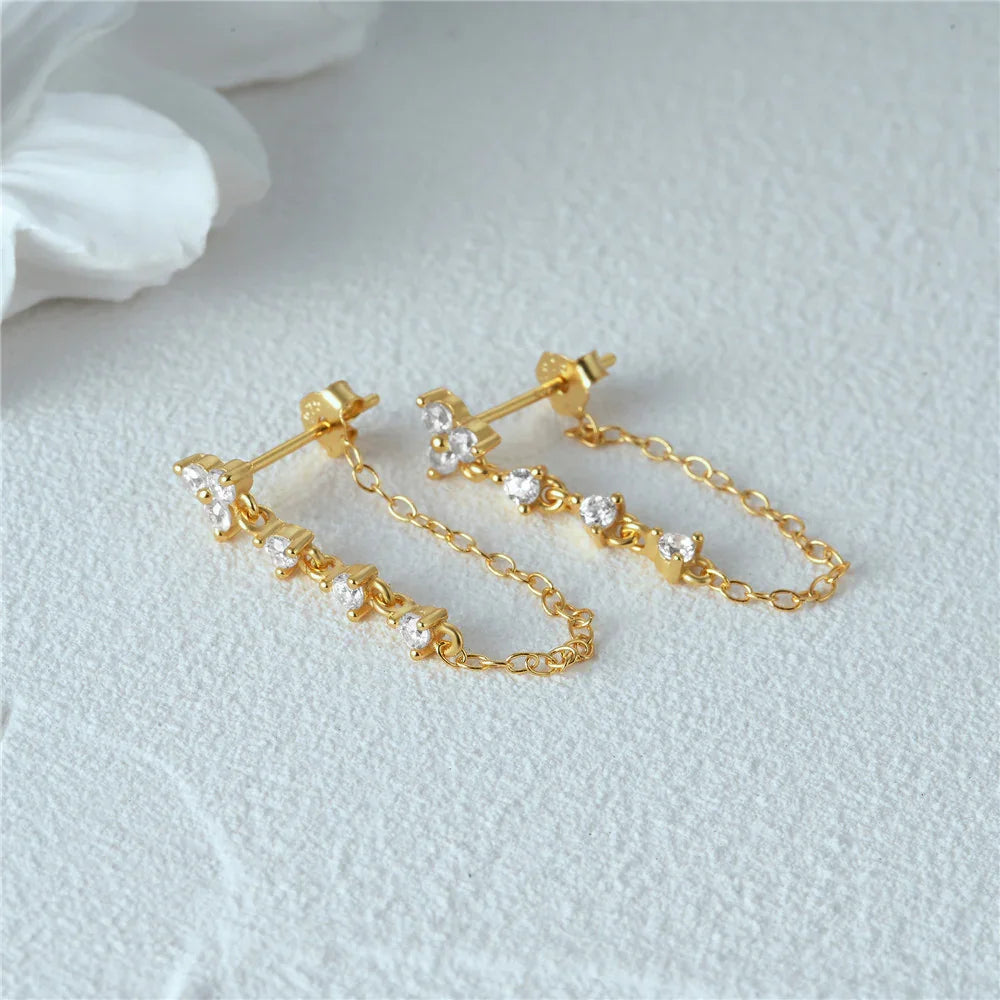 Pair of 18K gold chain stud earrings with linear cubic zirconia stone design dangling chain straps