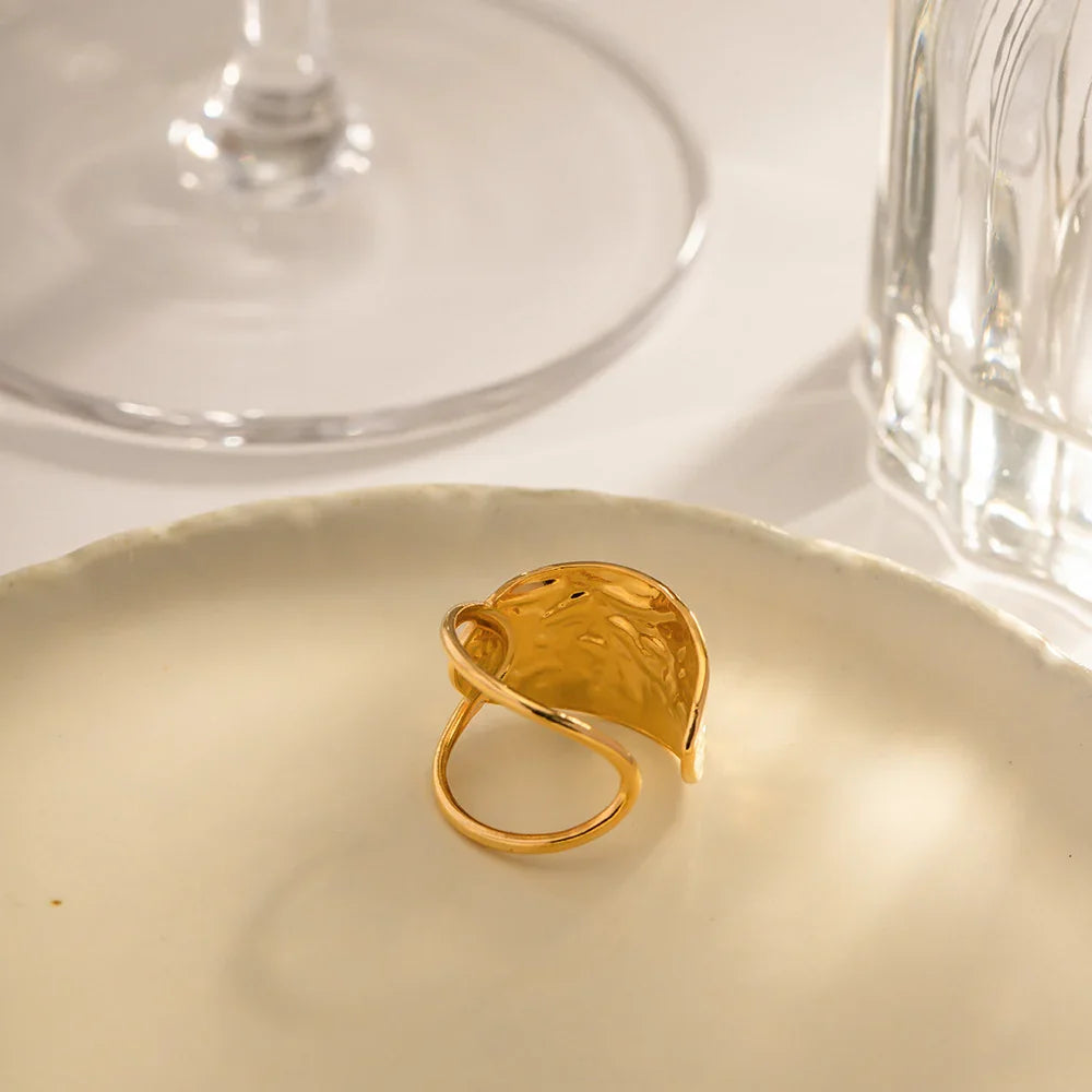 Top-down view 18K gold hammered open ring warm tone textured hollow design