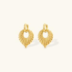 18K gold leaf drop hoop earrings with ribbed texture detail, front flat lay view on beige background showcasing the elegant gold-tone finish and organic leaf-shaped pendant design