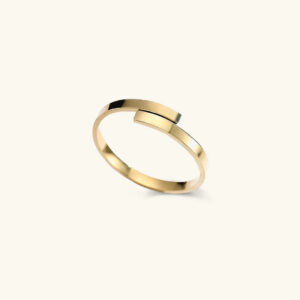 18K gold minimalist wrap ring with polished geometric overlapping band design, front view on neutral background