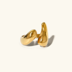18K gold abstract open ring with asymmetric curved design, polished smooth finish, flat lay product photography
