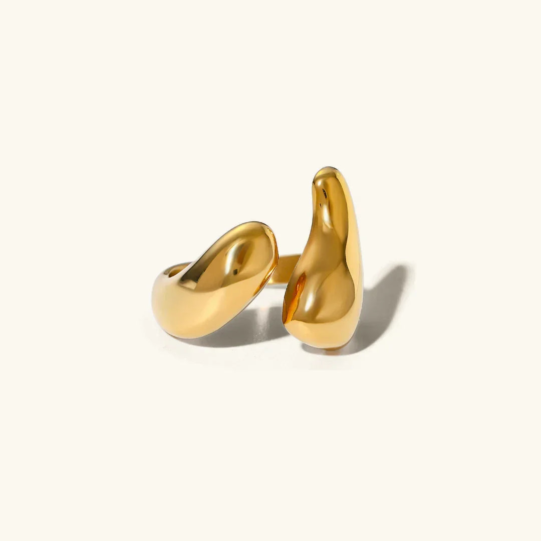 18K gold abstract open ring with asymmetric curved design, polished smooth finish, flat lay product photography