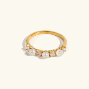 18k gold pearl diamond ring front flat lay design with alternating freshwater pearls and cubic zirconia stones on polished gold band