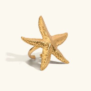 18K gold starfish ring adjustable open band flat lay front view with textured star design