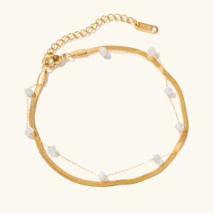 18K gold freshwater pearl anklet double chain flat lay design on white background showing herringbone gold links and white pearl strand