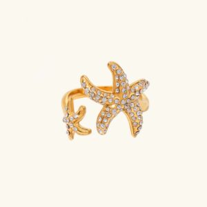 18K gold starfish diamond open ring front view flat lay with rhinestone paving on plain background