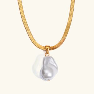 18K gold baroque pearl herringbone necklace front view flat lay with white pearl pendant on plain background