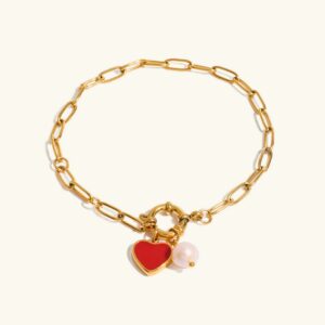 18K gold heart pearl charm bracelet with paperclip chain - flat lay on white background showing full design