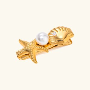 18K gold ocean hair clip with starfish shell and freshwater pearl accent flat lay front view