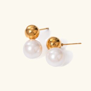 18K gold pearl dome earrings pair flat lay overhead view showcasing polished gold spheres with lustrous freshwater pearls on white background